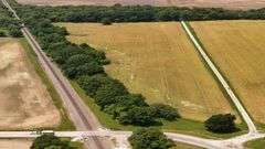 12.234 +/- Acres total; South of E 1625 Avenue and North of RR Tracks;9.62 +/- Acres Tillable with some woods, Rural Water Runs Along  Frontage.
