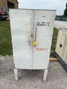 Metal Storage Cabinet 31” wide x 24” deep x 64” high, with 2 doors on cabinet, inside of cabinet has grease, transmission fluid, battery cleaner,  multi purpose lubricate, carburetor cleaner, house and siding cleaner, bag of rags, oil filters,