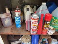 Metal Storage Cabinet 31” wide x 24” deep x 64” high, with 2 doors on cabinet, inside of cabinet has grease, transmission fluid, battery cleaner,  multi purpose lubricate, carburetor cleaner, house and siding cleaner, bag of rags, oil filters,