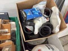 Coupling Kit bowl to tank, Valve Replacement seal for toilet tank, brass threaded clean out  covers, brass water meter, 9” AC/DC TV-VCR Combo, unknown condition, 2 gallon pump up sprayer, box of rubber gaskets, (4) wall clocks, box of various size bushings,