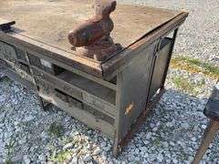 Workbench with 2 vises  size 4” & 3 1/2”, size of workbench is 73” long x 51” wide x 36” high, Masonite ove 2x lumber for workbench top, metal drawers front and back,