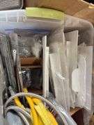Pallet of various ABS Fittings, plastic tote of gas line, flexible stranded water supply line, Hilti Epoxy Caulk gun,