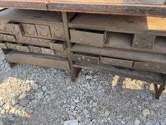 Workbench with 2 vises  size 4” & 3 1/2”, size of workbench is 73” long x 51” wide x 36” high, Masonite ove 2x lumber for workbench top, metal drawers front and back,