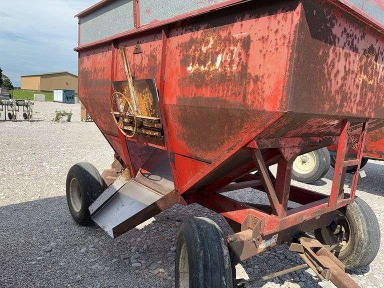 Huskee Running Gear, Flow EZ 250 Bushel Gravity Wagon, Tires hold Air, Tread 20%, Floor is good, unloading door works,