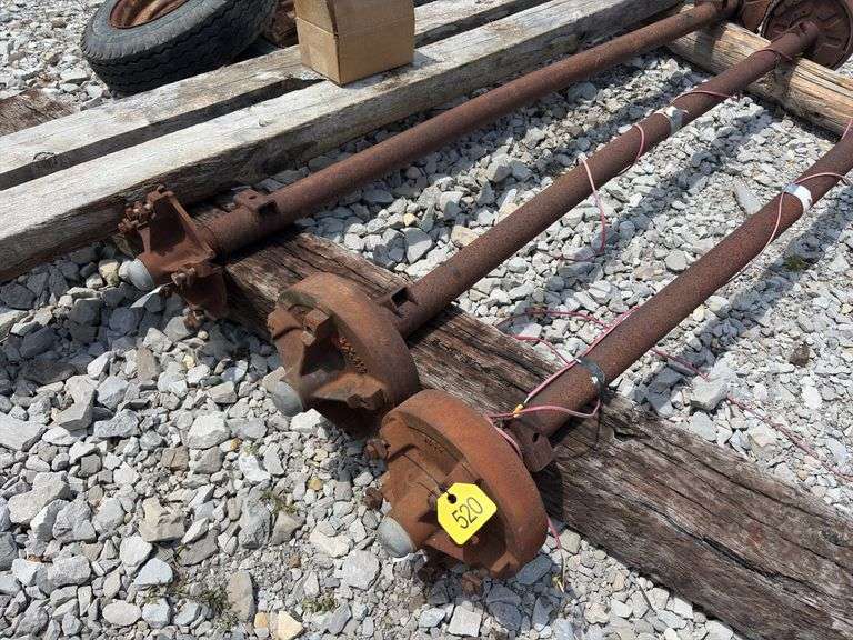 Mobile Home Axles,(2) with brakes (1) with out brakes, (5) wheels with lug nuts, (2) wood beams 4”x6”x 11’- 9”, good tread left on tires, hold air,
