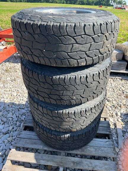 Cooper Discover A/T 31x10.50R15LT with 5 Hole Chrome Rims, 50% Tread