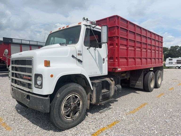 (TITLE) 1988 International S 2300 Tandem Grain Truck, 466 Diesel Engine, Air Brakes, Straight 7 Speed Transmission, 8’ Wide, 10’2” Tall, 26’ Long, Empty Weight Estimated 19,000-20,000#, 11R22.5 Tires (Good), Twin Screw, Spring Suspension ,Clutch And Front End Work Less Than 500 Miles Ago, 18’ Metal Grain Bed W/ Steel Floor (Nice), 64” Steel Sides, Single Post Hoist, Rust Free Frame And Cross Members,  Been Shedded Several Years, Great Tandem Truck, Miles Unknown’s