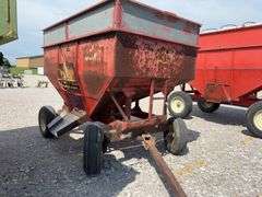 Huskee Running Gear, Flow EZ 250 Bushel Gravity Wagon, Tires hold Air, Tread 20%, Floor is good, unloading door works,