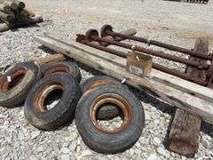 Mobile Home Axles,(2) with brakes (1) with out brakes, (5) wheels with lug nuts, (2) wood beams 4”x6”x 11’- 9”, good tread left on tires, hold air,