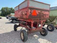 Huskee Running Gear, Flow EZ 250 Bushel Gravity Wagon, Tires hold Air, Tread 20%, Floor is good, unloading door works,