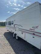 1998 Jayco  28’ Camper Trailer, Everything Works Per Consignor, Window Seals Recaulked,Good Tires, New Spare Tire, Eagle Model, Double Bed, (2) Single Bunk Beds, Above Average Condition For Its Age. Been Used By A Smoker.