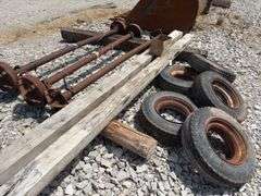 Mobile Home Axles,(2) with brakes (1) with out brakes, (5) wheels with lug nuts, (2) wood beams 4”x6”x 11’- 9”, good tread left on tires, hold air,