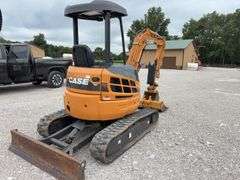 Case CX36B Mini Excavator, 698.6 hours, 12” Wide Rubber Tracks, 67” wide Blade, 36” Smooth Bucket, 18” Toothed Bucket, Pilot Controls, Hydraulic Thumb, Yanmar Diesel Engine Model #3TNV88-BPYB, 28 hp., Service at 671.9 hrs., Dent on Front and Side, 8,000 lb, 10’ Digging Depth,