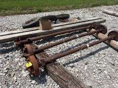 Mobile Home Axles,(2) with brakes (1) with out brakes, (5) wheels with lug nuts, (2) wood beams 4”x6”x 11’- 9”, good tread left on tires, hold air,