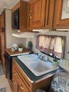 1998 Jayco  28’ Camper Trailer, Everything Works Per Consignor, Window Seals Recaulked,Good Tires, New Spare Tire, Eagle Model, Double Bed, (2) Single Bunk Beds, Above Average Condition For Its Age. Been Used By A Smoker.