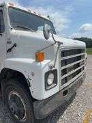 (TITLE) 1988 International S 2300 Tandem Grain Truck, 466 Diesel Engine, Air Brakes, Straight 7 Speed Transmission, 8’ Wide, 10’2” Tall, 26’ Long, Empty Weight Estimated 19,000-20,000#, 11R22.5 Tires (Good), Twin Screw, Spring Suspension ,Clutch And Front End Work Less Than 500 Miles Ago, 18’ Metal Grain Bed W/ Steel Floor (Nice), 64” Steel Sides, Single Post Hoist, Rust Free Frame And Cross Members,  Been Shedded Several Years, Great Tandem Truck, Miles Unknown’s