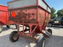 Huskee Running Gear, Flow EZ 250 Bushel Gravity Wagon, Tires hold Air, Tread 20%, Floor is good, unloading door works,