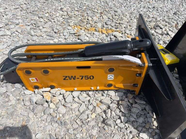 Unused Wuxi Wolverine Skid Steer Attach ZW-750 Hydraulic Breaker, Model # CB-11-750F, 2 breaker bits pointed, Nitrogen Tank, Toolbox, Standard Flow Hydraulics, 750 ft/lbs,