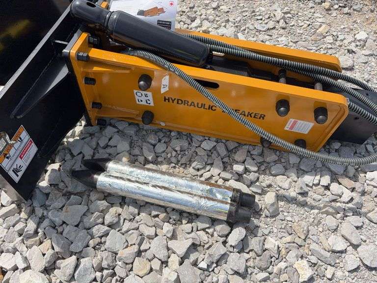 Unused Wuxi Wolverine Skid Steer Attach ZW-750 Hydraulic Breaker, Model # CB-11-750F, 2 breaker bits pointed, Nitrogen Tank, Toolbox, Standard Flow Hydraulics, 750 ft/lbs,