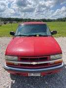 (TITLE) 1999 Chevrolet Blazer,  Touch 4 Wheel Drive, Starts And Runs, AM/FM CD Player, AUX Jack, Cruise Control, Power Steering, Push Button Rear Hatch, Rear Defrost, Leather Front Bucket Seats In Rough Condition, Center Counsel Is Broken, Hood Release Latch In Cab IS Broke, Back Hatch Opens, P235/75R15 Tires Approx 50% Tread, Body in Fair Condition Just Scratches and Losing Clearcoat and Some Minor Dents, 180,202 Miles, Does Have Dead Battery, Signed Title In Hand