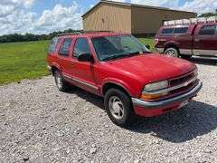 (TITLE) 1999 Chevrolet Blazer,  Touch 4 Wheel Drive, Starts And Runs, AM/FM CD Player, AUX Jack, Cruise Control, Power Steering, Push Button Rear Hatch, Rear Defrost, Leather Front Bucket Seats In Rough Condition, Center Counsel Is Broken, Hood Release Latch In Cab IS Broke, Back Hatch Opens, P235/75R15 Tires Approx 50% Tread, Body in Fair Condition Just Scratches and Losing Clearcoat and Some Minor Dents, 180,202 Miles, Does Have Dead Battery, Signed Title In Hand