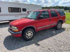 (TITLE) 1999 Chevrolet Blazer,  Touch 4 Wheel Drive, Starts And Runs, AM/FM CD Player, AUX Jack, Cruise Control, Power Steering, Push Button Rear Hatch, Rear Defrost, Leather Front Bucket Seats In Rough Condition, Center Counsel Is Broken, Hood Release Latch In Cab IS Broke, Back Hatch Opens, P235/75R15 Tires Approx 50% Tread, Body in Fair Condition Just Scratches and Losing Clearcoat and Some Minor Dents, 180,202 Miles, Does Have Dead Battery, Signed Title In Hand
