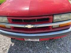 (TITLE) 1999 Chevrolet Blazer,  Touch 4 Wheel Drive, Starts And Runs, AM/FM CD Player, AUX Jack, Cruise Control, Power Steering, Push Button Rear Hatch, Rear Defrost, Leather Front Bucket Seats In Rough Condition, Center Counsel Is Broken, Hood Release Latch In Cab IS Broke, Back Hatch Opens, P235/75R15 Tires Approx 50% Tread, Body in Fair Condition Just Scratches and Losing Clearcoat and Some Minor Dents, 180,202 Miles, Does Have Dead Battery, Signed Title In Hand