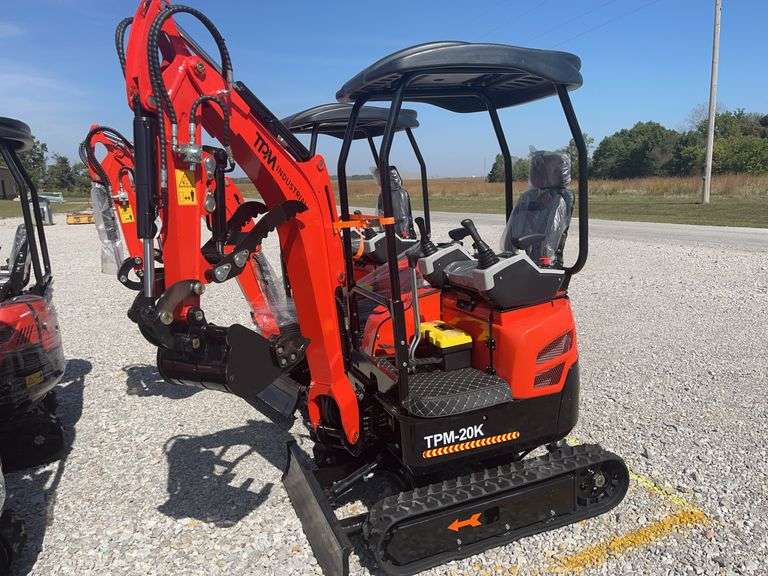 Unused TPM-20K Diesel Mini Excavator, Yanmar 374 Diesel Engine, 11.2KW Kubota Diesel Engine, 3100lb Operating Weight, Pilot Controls, Power Shut Off, Hydraulic Arm, Light On Arm, 16” Bucket With 3 Teeth, 43” Push Blade, 7” Rubber Tracks, Rear Door For Engine Maintenance, 4 Post Canopy, Arm Rests, Counter Weight, Hour Meter