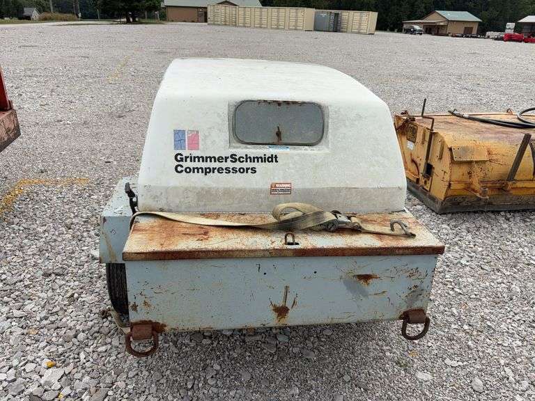 Grimmer Schmidt Air Compressor, Pull  Behind, Tires hold Air, Tire Tread 30% left, Won’t start has solenoid issues, 8 cylinder Ford Gas Engine, Unknown Condition, Serial # 17511881 Q, 175 CFM, 2400 RPM, 1479 hours on Meter, Engine Rebuilt at 900 Hours,