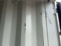 MMS 10’-3’’ container, measures 10’-1” long x 7’-3 1/2” wide x 8’-3” tall, swinging rear doors, Side walk door, sliding window, keyed lock on walk door, wood floor, container CTTN 0002089, Small Paint Scratches, Window Damage