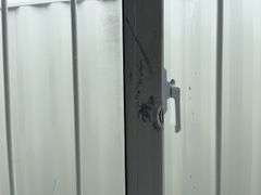 MMS 10’-3’’ container, measures 10’-1” long x 7’-3 1/2” wide x 8’-3” tall, swinging rear doors, Side walk door, sliding window, keyed lock on walk door, wood floor, container CTTN 0002089, Small Paint Scratches, Window Damage