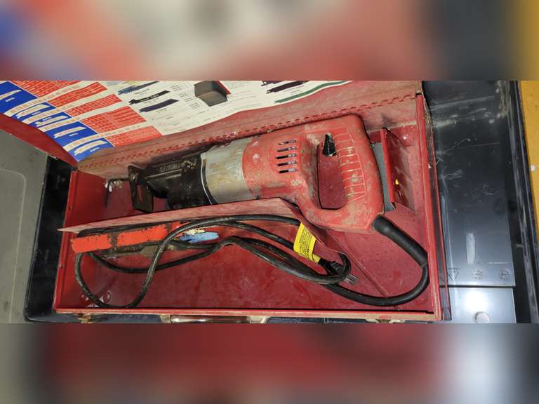 Milwaukee elec. sawzall w/ blades & case Lindsay Auctions & Realty LLC