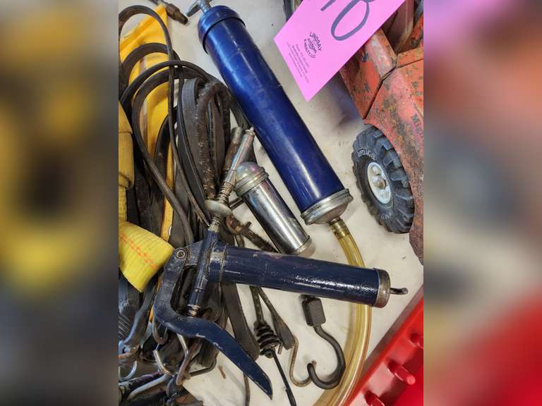 2 grease guns, suction gun, magnet, tow strap, 2 framing squares, grab handles