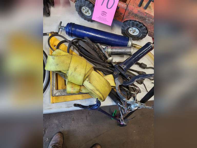 2 grease guns, suction gun, magnet, tow strap, 2 framing squares, grab handles