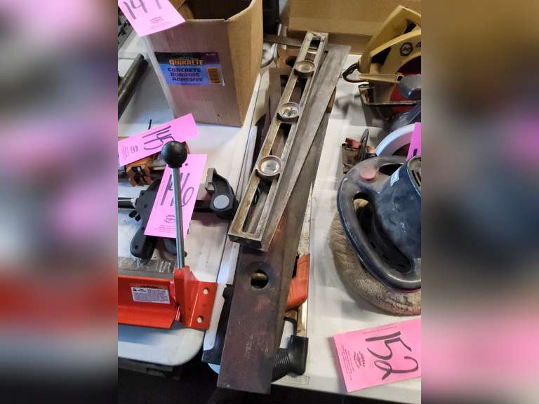 Group: 2 hand saws, 2 hack saws, 2 framing squares, 2 levels