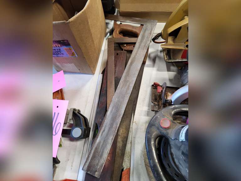 Group: 2 hand saws, 2 hack saws, 2 framing squares, 2 levels