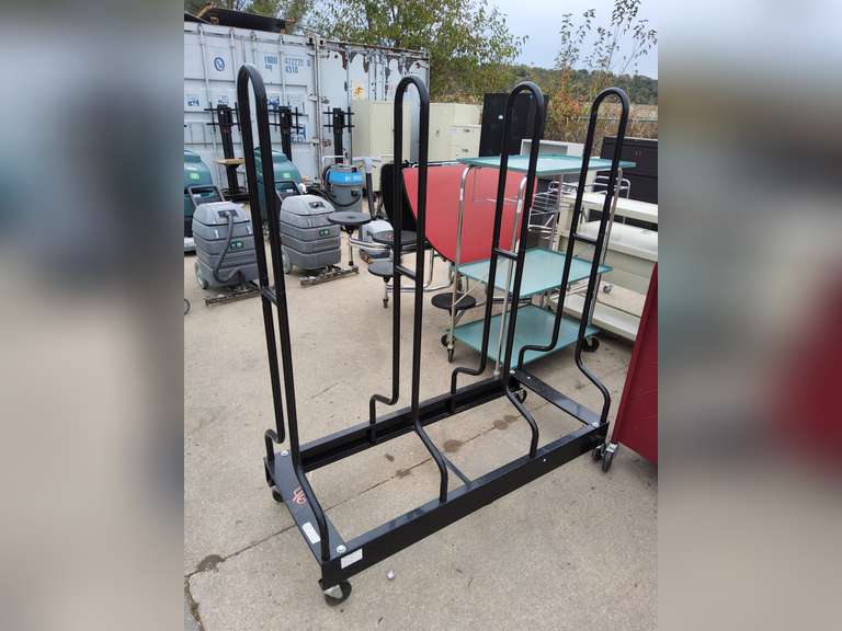 Metal rack on wheels (possibly for tables?)