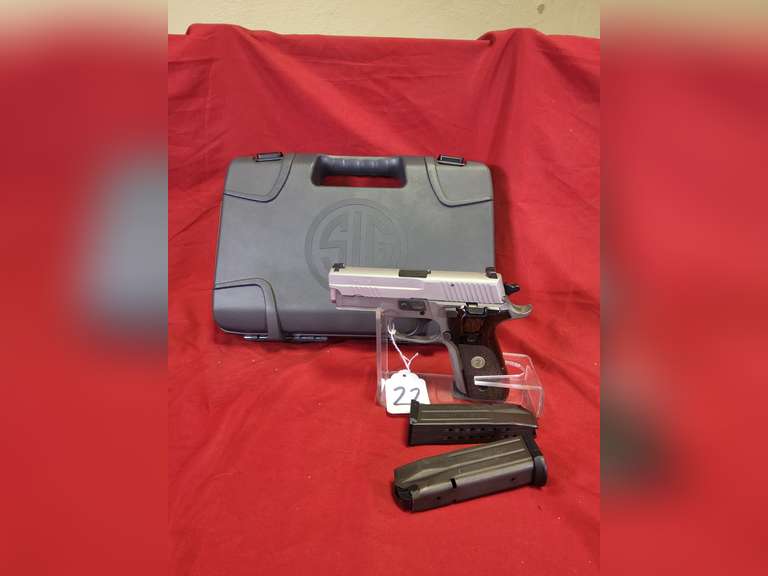 Sig Sauer Mod: P229 Elite, 9mm pistol, Ser#: 55E039100, 3.9" brl, stainless, siglite sights, wood grips, 2 mags, box, book, 98% (believe to be new)