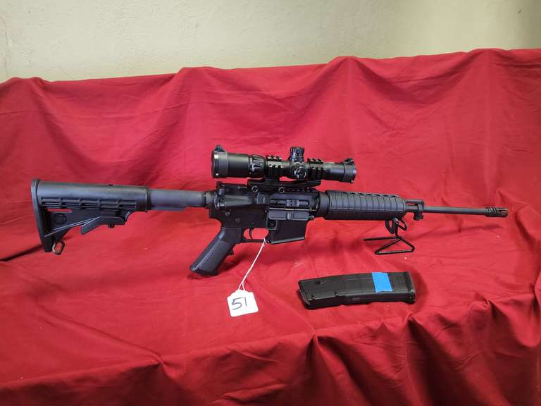 Bushmaster Mod: XM15-E2S, 5.56 nato semi rifle, Ser#: BK5050693, 18" brl, flat top, telescoping stock, 1 mag, aim point 1.5-4x30 scope, 98%