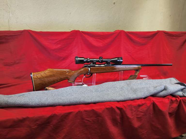 S&W Mod: 1500, 243 bolt rifle, Ser#: PN37964 , 23" brl, wood stock, leather sling, Simmons 3-9xWA scope, made in Japan, soft case, 96%