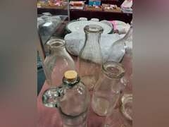 Group of vintage glass bottles various sizes
