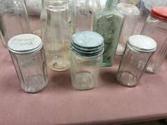 Group of vintage glass bottles various sizes