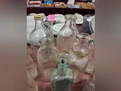Group of vintage glass bottles various sizes
