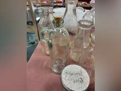 Group of vintage glass bottles various sizes