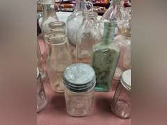 Group of vintage glass bottles various sizes