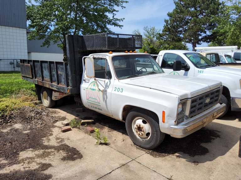 1980 Chevy 1 ton, V8, auto trans, showing 68227 miles, pwr steer, pwr brakes, crank windows, AC, 2 fuel tanks, 12.5ft dump bed,  Vin#CCM33AV142173, -- Truck #203 (HAS TITLE)