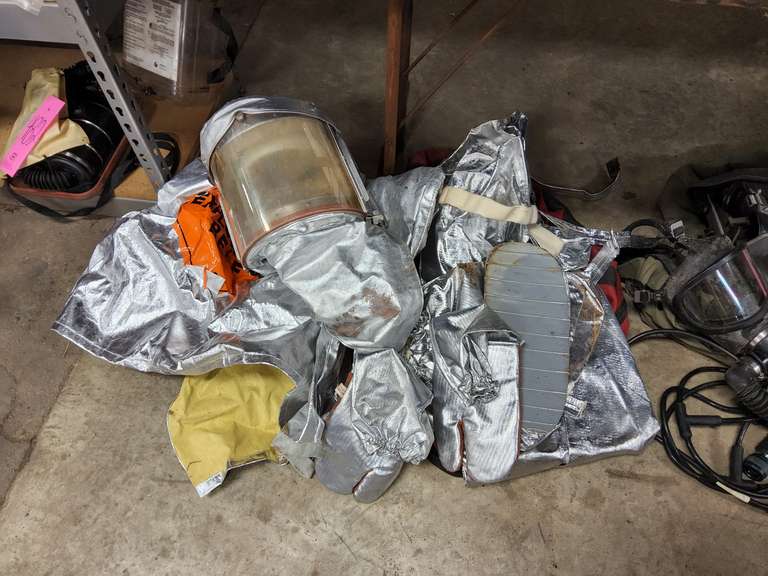 Some type of scuba diving gear, a protective suit & Aluminized fire proximity suit (boots, gloves, pants, jacket, & hood)