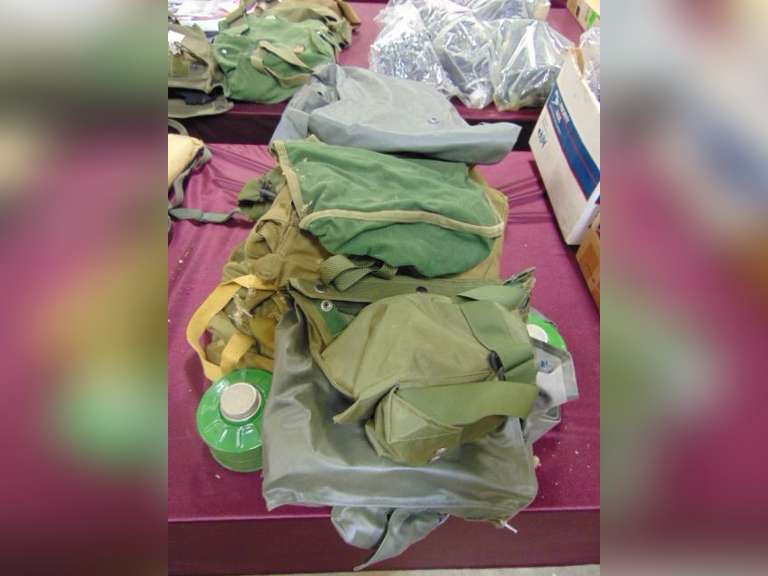 Group of various gas mask bags (some with contents, masks are missing)