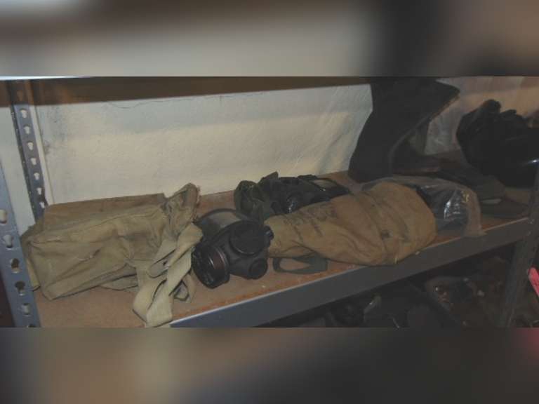 Group of gas masks, filters, rubber boots