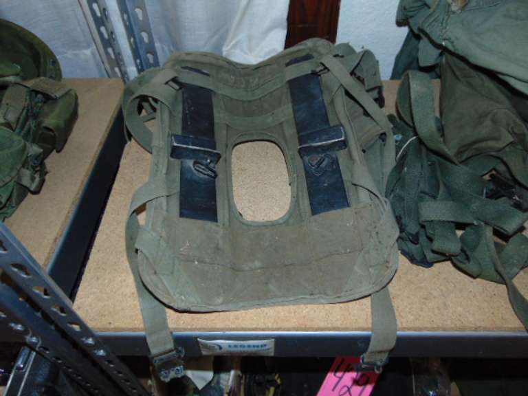 Group: Military winter coat & pants, frame/harness for a AN/PRC-77 portable radio, & other SEE PICS